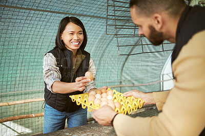 Buy stock photo Egg production, food business and Asian woman happy about eco friendly agriculture growth of eggs. Chicken farmer, sustainability and farming product check of a worker in a chicken coop with a smile
