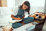 Travel, planning and woman in bedroom with suitcase for summer, vacation or holiday information, checklist and website. Location, hotel and journal book of girl writing notes with clothes in luggage