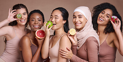Buy stock photo Skincare, diversity and women with fruit for beauty, nutrition and group diet on a studio background. Vitamin c, happy health and portrait of model friends with food for wellness and body detox