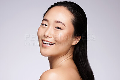 Buy stock photo Skincare, dermatology and Asian woman with beauty, marketing spa and luxury cosmetics on a grey studio background. Wellness, happy and face portrait of a model smile for advertising healthy skin