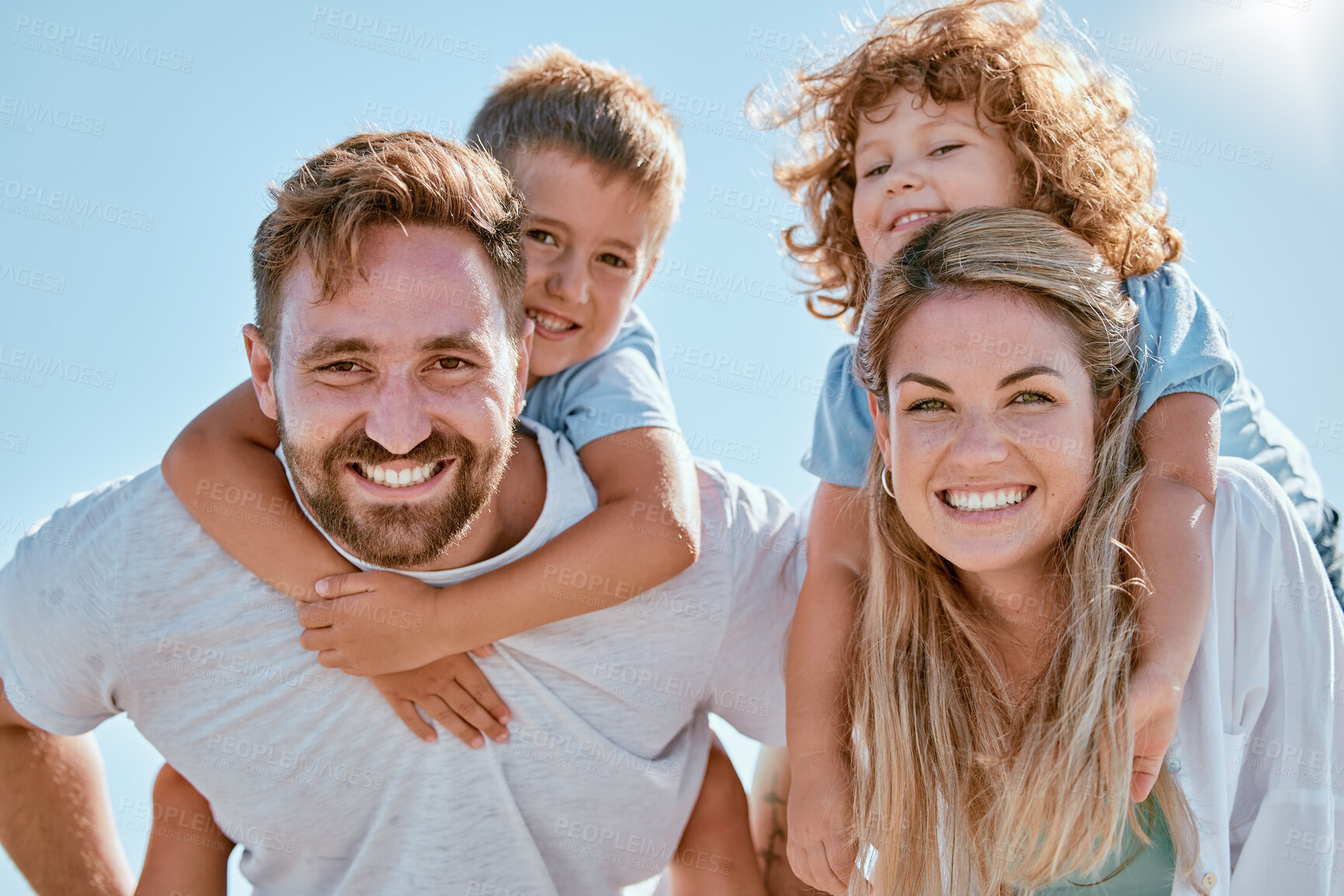 Buy stock photo Happy family, portrait and piggy back in summer sunshine, smile and happy for bonding, relax and freedom. Family, happiness and children with mom, dad and love on holiday adventure with sky in Cancun