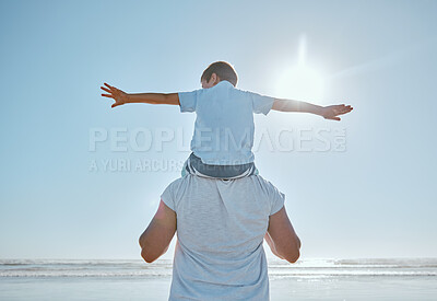 Buy stock photo Family, beach and summer vacation for freedom with a child on shoulder of father with hands outstretched for happiness against blue sky. Man and kid son together at sea for trust, nature and peace