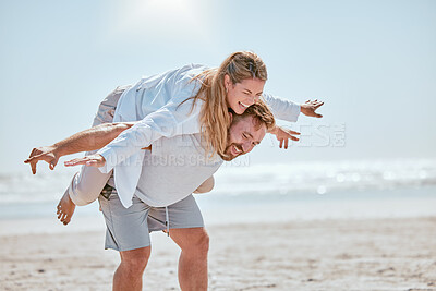 Buy stock photo Couple, happy and beach holiday with travel, fun and playful together, anniversary vacation by the ocean with freedom and comedy. Happiness, man with woman and laugh, love and piggyback on Bali coast