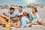 Guitar, beach picnic and family on holiday, ocean bonding and musical entertainment in Portugal. Happy, travel and man playing instrument music on vacation, quality time and children with mom