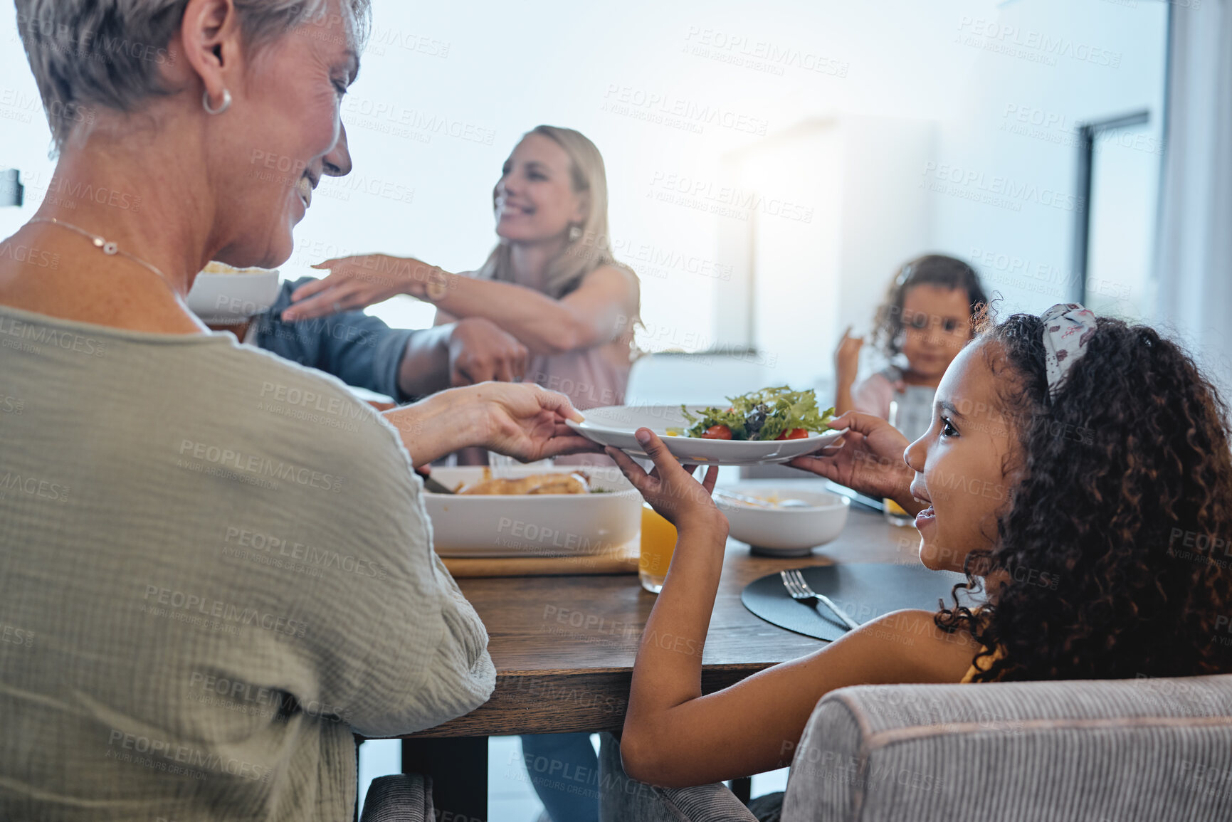 Buy stock photo Family, food and nutrition, together for lunch and grandmother with child and plate, salad and meal at family home. Love, bonding and happy people with generations, big family and relationship.