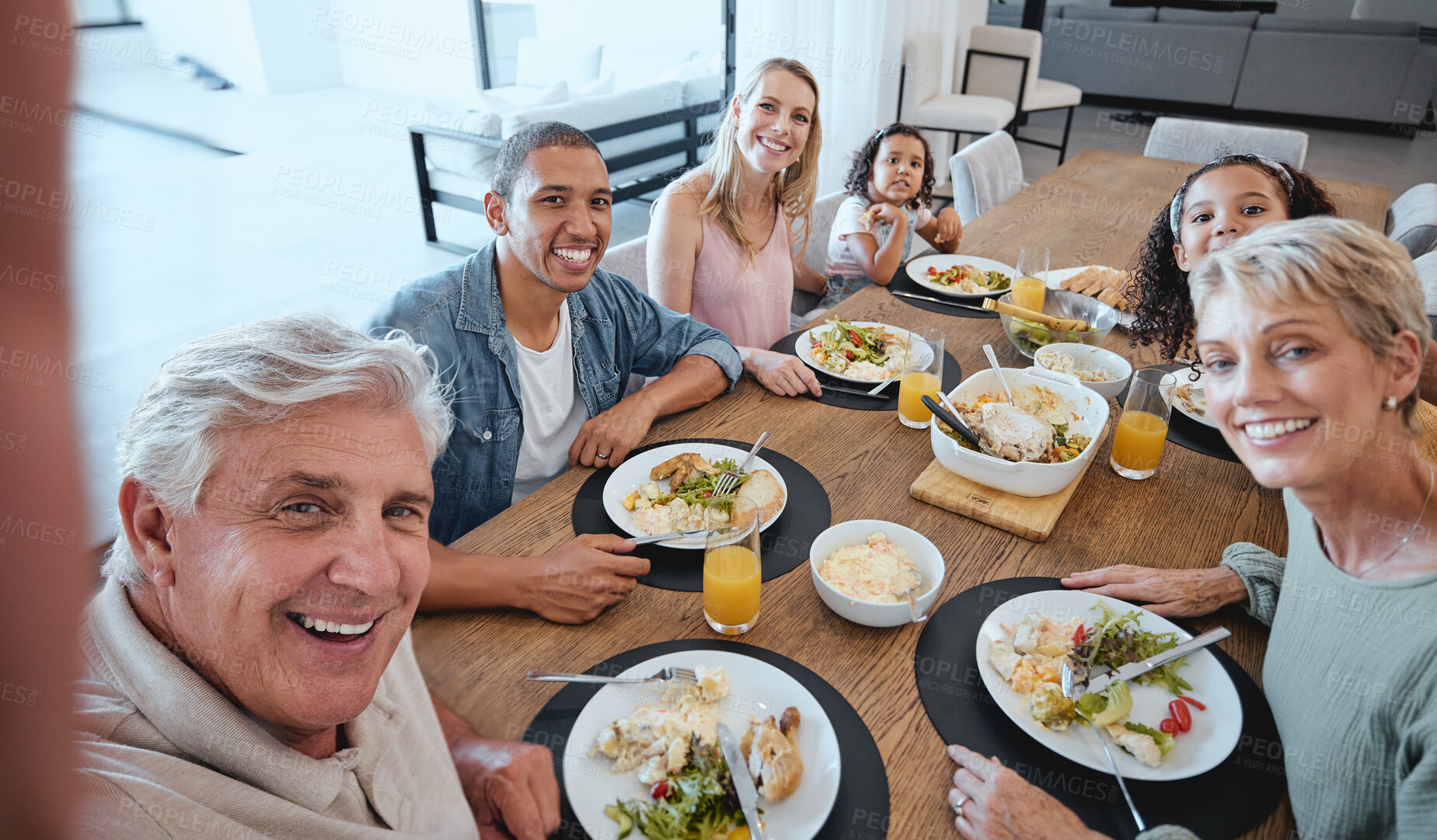 Buy stock photo Big family, lunch and selfie with food on table in home dining room. Fine dining, happy memory and grandma, grandpa and father, mother and girls with healthy meal taking pictures for social media.