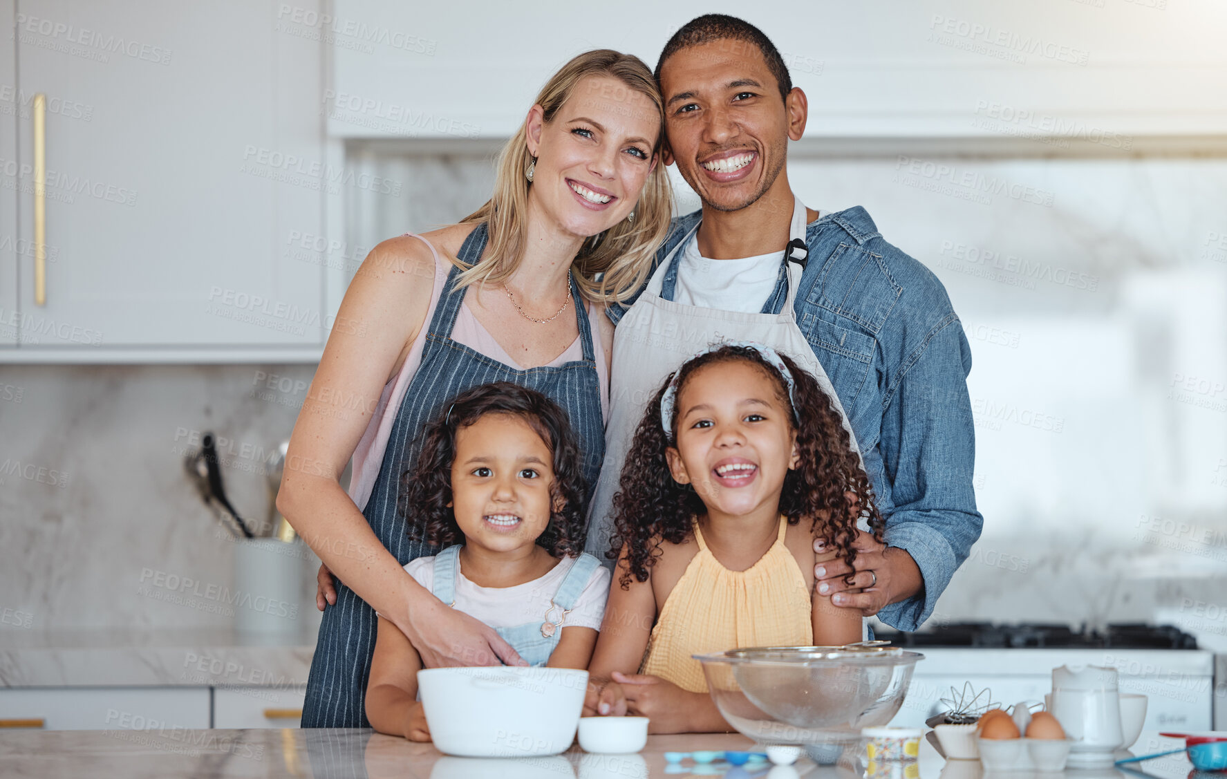 Buy stock photo Happy, smile and portrait of a family in the kitchen cooking together for a party, dinner or event. Happiness, love and interracial parents bonding and baking with their children in their modern home