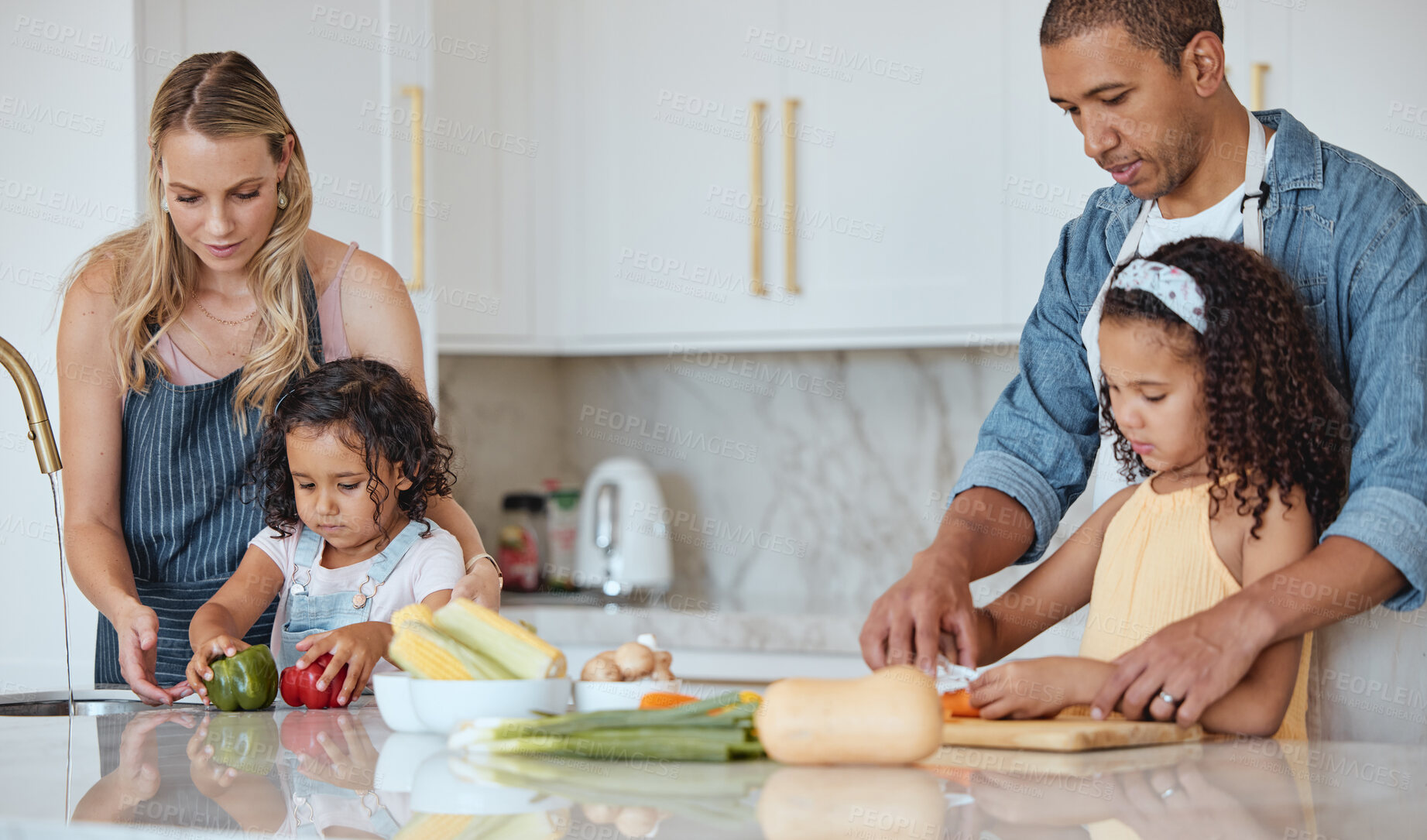 Buy stock photo Cooking, family and kitchen learning of a girl with mother and dad with love and parent support. Interracial, teaching and vegetables in a house with children and parents making health and diet food