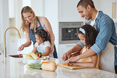 Buy stock photo Family, mother and father with girls, vegetables or cooking together, interracial or bonding. Love, man and woman happy with daughters, cutting or rinse veggies in kitchen, child development or relax