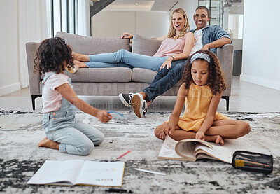 Buy stock photo Learning, education and kids with family in living room studying. Home school, diversity and girls reading books, writing or drawing with mother and father on sofa supporting development in house.