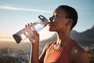 Buy stock photo Water, hydration and black woman running in nature, fitness rest and health for exercise in Turkey. Energy, break and training African runner drinking water for body detox during an outdoor workout