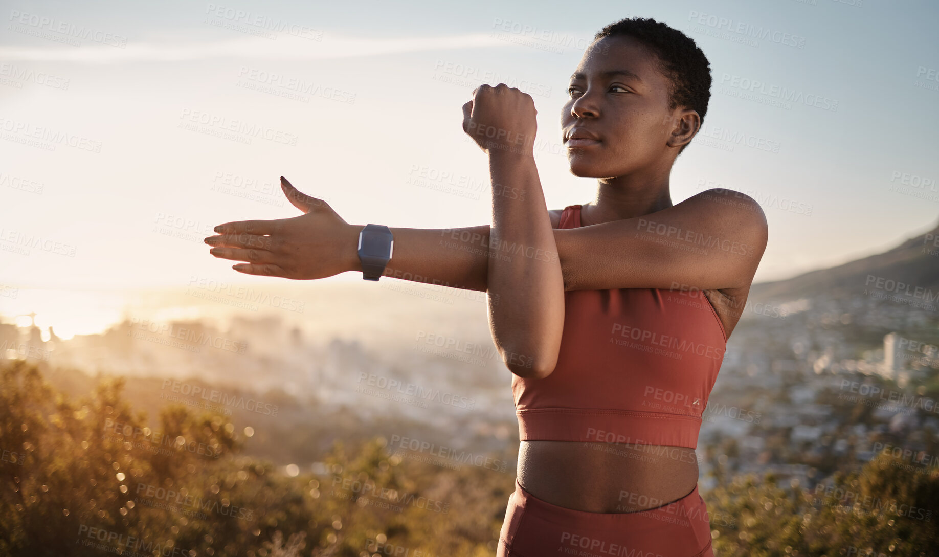 Buy stock photo Exercise, fitness and black woman stretching arm outdoors for health and wellness. Thinking, sports training and female preparing, warm up and getting ready for cardio, workout or running at sunset.