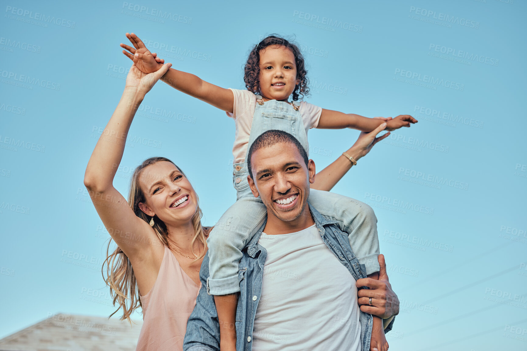 Buy stock photo Family, children and piggyback with a girl sitting on the shoulders of her father while mother is outdoor together. Interracial, kids and love with a man, woman and daughter bonding outside in summer