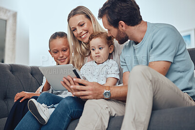 Buy stock photo Happy family, tablet and relax sofa in living room together for quality time, bonding and streaming video online. Parents, children smile and watching on digital tech device on couch in family home