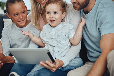 Buy stock photo Digital tablet, relax and happy family on sofa streaming a movie online together at their home. Happiness, fun and parents with their children watching video on the internet or social media on mobile