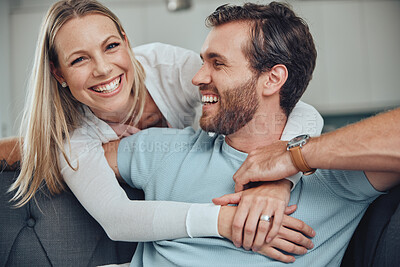 Buy stock photo Portrait, love and couple relax on a sofa, embrace and smile while bonding in their home together. Face, man and woman  hug, happy and enjoy quality time, relationship and fun in their living room