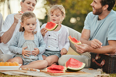 Buy stock photo Park, picnic and couple with children and fruit on blanket in garden for happy summer family time together. Nature, love and relax eating lunch on grass with parents and kids with smile on holiday.