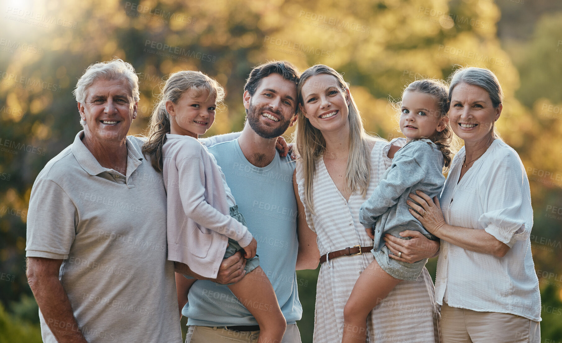 Buy stock photo Love, family and grandparents with girls, parents and smile together for bonding, loving in park. Portrait, grandmother and grandfather with mother, father and daughters for vacation and outdoor.