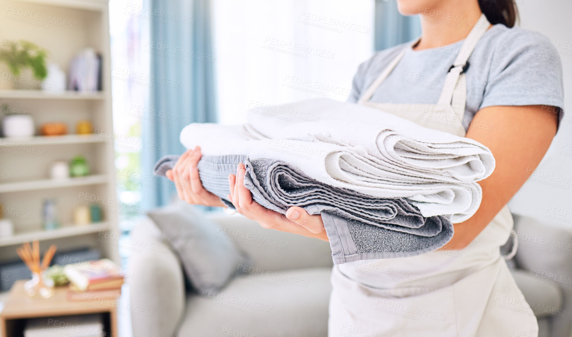 Buy stock photo Hands, clean towels and woman with laundry, linen or cotton textile in stack at home. Spring cleaning, hygiene and female cleaner with fresh, cleaned or washed pile of fabric, towel or cloth in house