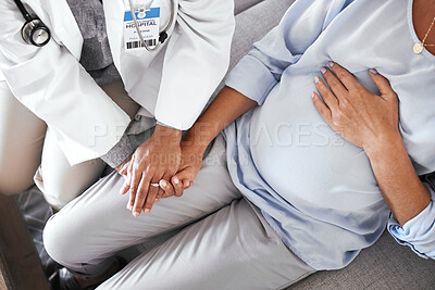 Buy stock photo Healthcare, pregnancy and hands of doctor with pregnant woman for support, comfort and compassion on sofa. Medical care, family home and top view of health worker holding hands with maternal patient