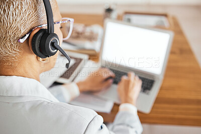 Buy stock photo Senior woman, headphones and working on laptop for telemarketing communication, customer service consulting and crm contact us support. Mature call center agent, typing and digital consultant back