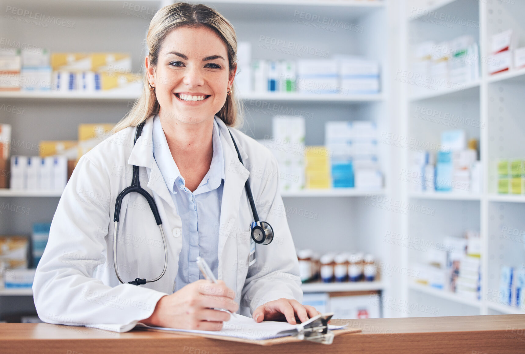 Buy stock photo Portrait, happy or pharmacist writing a checklist of medicine inventory or healthcare stock supply on pharmacy counter. Wellness, trust or face of chemist working on store drugs paperwork with smile