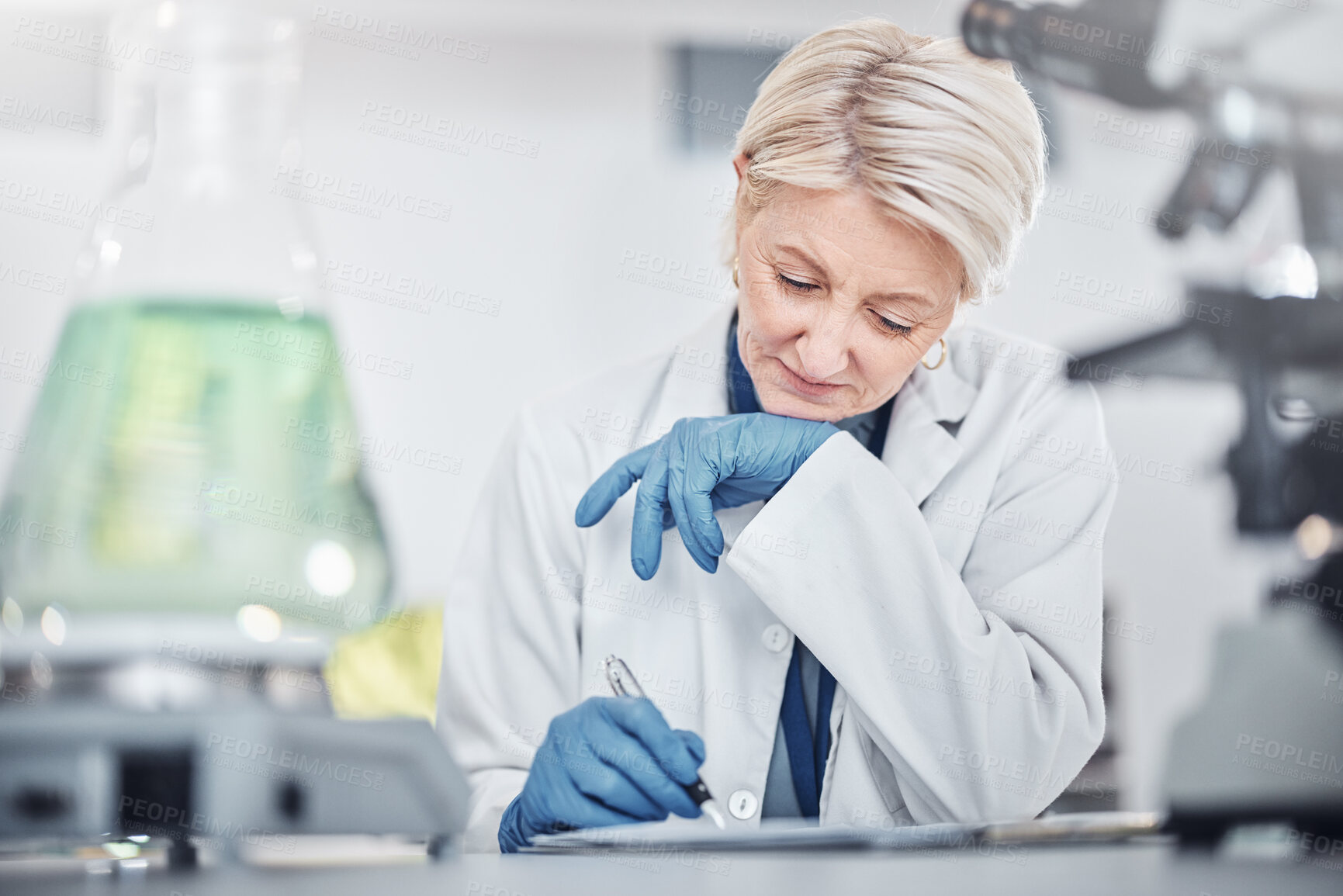 Buy stock photo Science, research and senior woman writing notes on documents in laboratory. Innovation, thinking and elderly female scientist researching, recording and write experiment results, analysis or report.