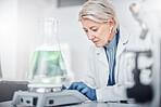 Senior scientist woman, laboratory and beaker for study, analysis and focus for job in pharma industry. Science, lab and working with pharmaceutical research for vision, future or analytics in Sweden