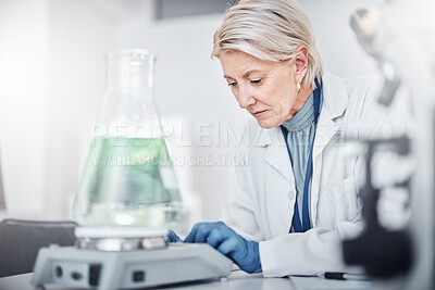 Buy stock photo Senior scientist woman, laboratory and beaker for study, analysis and focus for job in pharma industry. Science, lab and working with pharmaceutical research for vision, future or analytics in Sweden