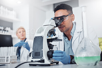 Buy stock photo Science, microscope and innovation with a doctor man in a laboratory for research or medical development. DNA, healthcare and medicine with a male scientist working in a lab for sample analysis