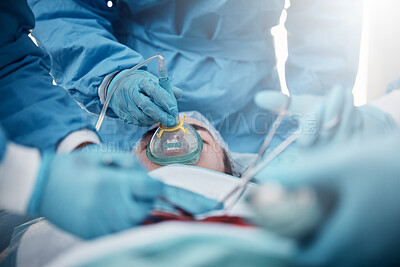 Buy stock photo Doctors, surgery and oxygen mask with a medicine team in scrubs operating on a man patient in a hospital. Doctor, nurse and teamwork with a medical group in a clinic to perform an emergency operation