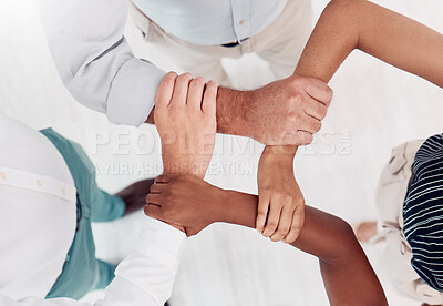 Buy stock photo Top view, business people hands or holding wrists in collaboration, office workshop or solidarity for teamwork diversity, community or motivation. Men, women or creative support arms for target goals