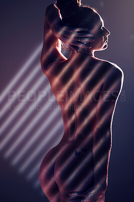 Buy stock photo Sensual, blinds and woman posing in a studio with an alluring, sexy and seductive pose with light. Slim, naked and nude body of a female model with stripe pattern isolated by a dark black background.
