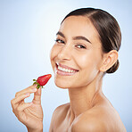 Beauty, strawberry and face with skincare, woman with glow and natural cosmetics with organic treatment and portrait. Fruit, healthy skin and wellness with nature product against studio background.