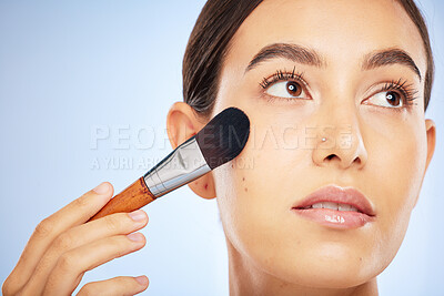 Buy stock photo Woman, face and thinking with makeup brush for skincare beauty, luxury skin wellness and cosmetics dermatology in studio. Facial care, product application or spa vision aesthetic in blue background