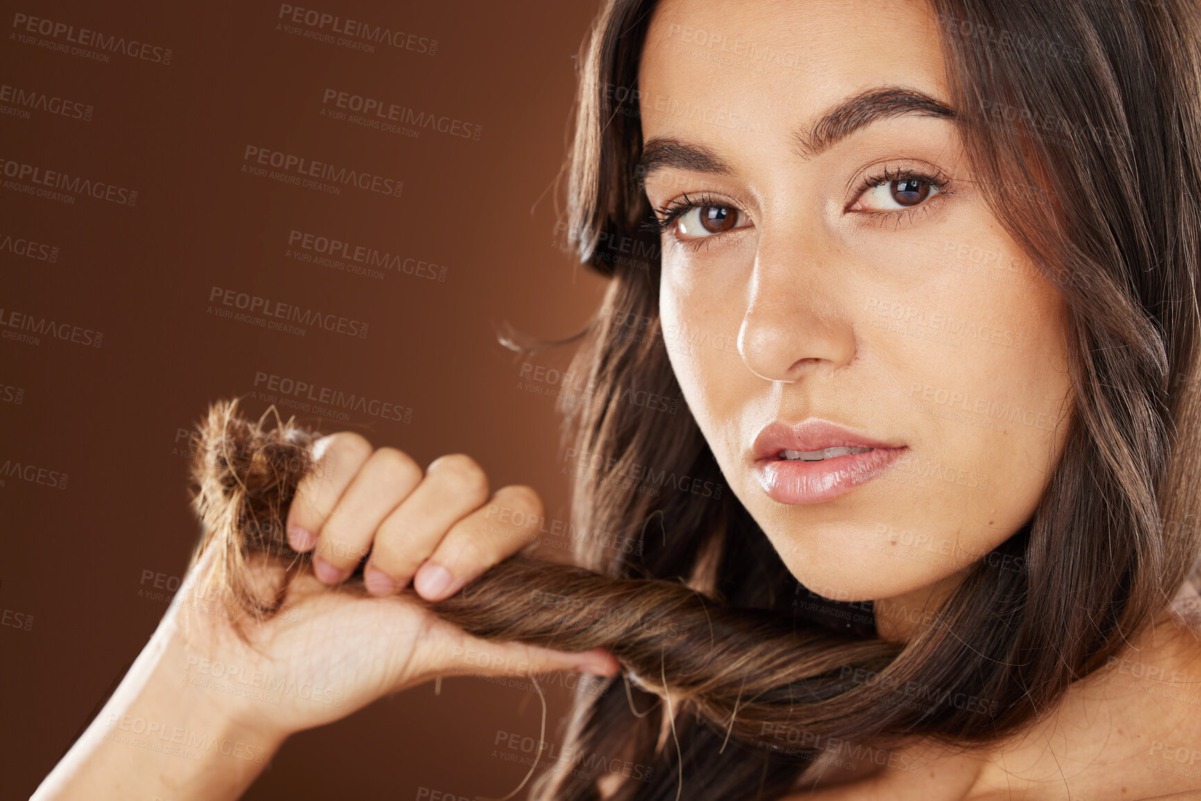 Buy stock photo Face portrait, hair care and beauty of woman in studio isolated on a brown background. Wellness, hairstyle and aesthetics of female model with healthy and long hair after salon treatment for growth.