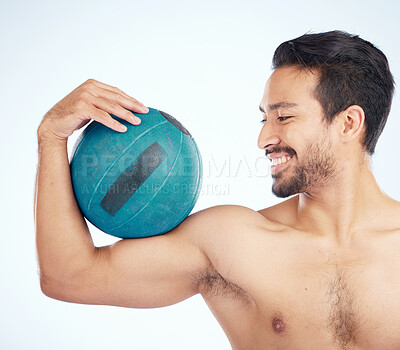 Buy stock photo Face, fitness and man with medicine ball for exercise and health in studio on a blue background. Sports, training and happy male athlete with ball weight for strength, exercising and muscle power.