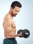 Man, fitness and dumbbell in studio for muscle, wellness and self care by blue background with focus. Model, bodybuilder workout and training for health, body or development with exercise by backdrop