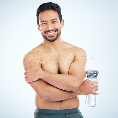 Buy stock photo Man, fitness and water bottle in studio portrait with smile, health or wellness exercise by blue background. Model, shirtless or water for self care, self love or body positivity by studio backdrop