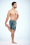 Fitness, health and man stretching leg in studio isolated on a blue background mock up. Sports, body wellness and young male athlete stretch, warm up and preparing for workout, exercise and training.