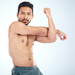 Man, body or stretching arms on studio background in workout tension release, exercise pain relief or training healthcare wellness. Portrait, sports athlete or fitness model warm up of strong muscles