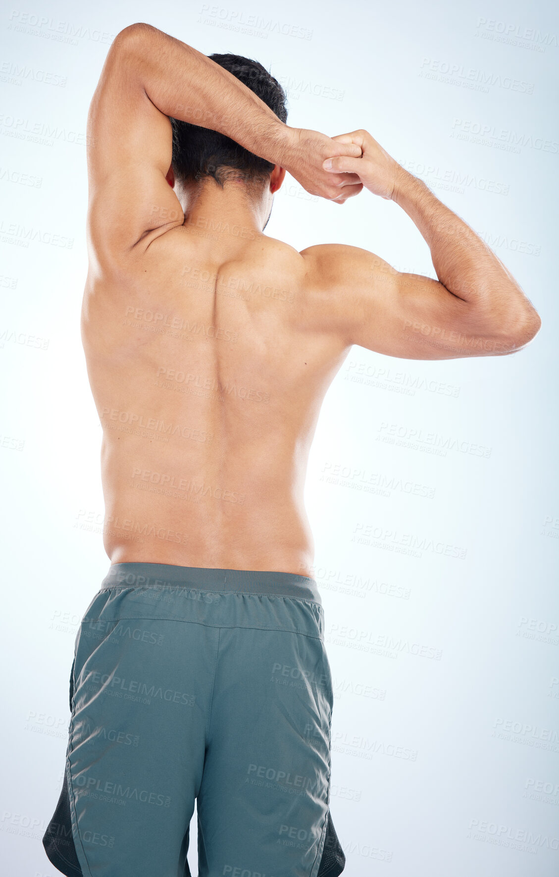 Buy stock photo Man, fitness stretching and back view for muscle wellness, body care and sports exercise or warm up in studio. Athlete, arm stretch and bodybuilder training, healthy performance or  spine workout