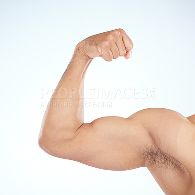 Buy stock photo Bodybuilder, bicep muscle and closeup in studio for gym, wellness or fitness by blue background. Model, growth or development for flex, strong or healthy from exercise, workout or training of body