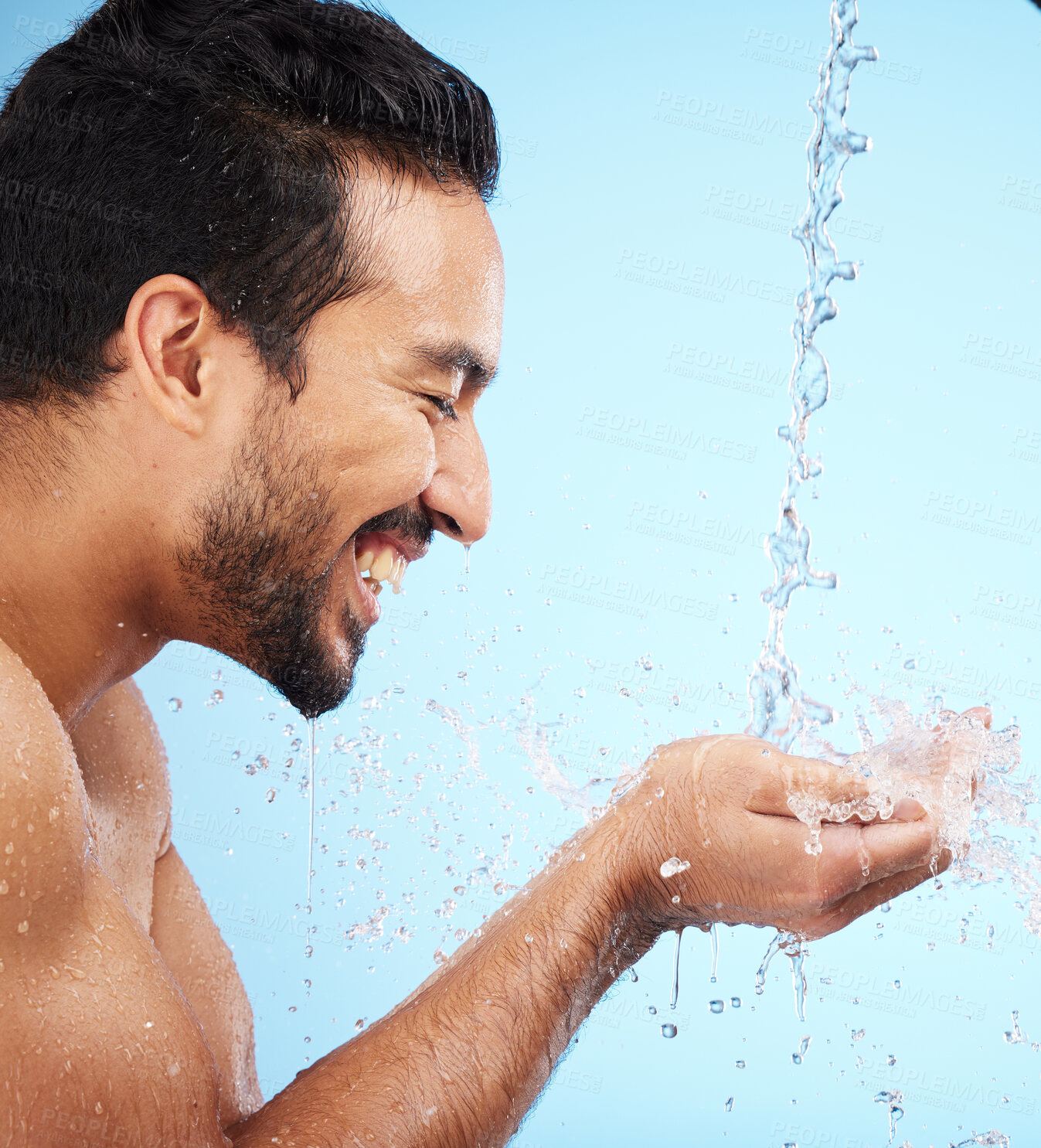 Buy stock photo Water, hands or man in shower in studio cleaning body for wellness or skincare with a happy smile. Water splash, mock up or relaxed model washing for self care grooming with marketing or mockup space
