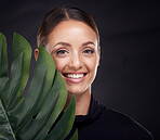 Beauty, face and skin with leaf and woman with natural cosmetics, green and sustainable skincare against black studio background. Portrait, mockup and nature, tropical organic product and wellness.