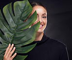 Beauty, skin and face with leaf and woman, skincare with nature aesthetic, natural cosmetics and facial portrait against studio background. Smile, glow with organic cosmetic treatment and wellness.