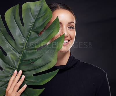 Buy stock photo Beauty, skin and face with leaf and woman, skincare with nature aesthetic, natural cosmetics and facial portrait against studio background. Smile, glow with organic cosmetic treatment and wellness.