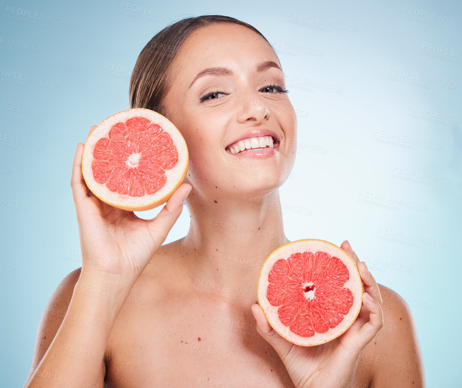 Buy stock photo Woman, grapefruit and facial skincare wellness for natural beauty, salon spa care and luxury organic treatment in blue background. Model happiness, smile and vitamin c for face cosmetics dermatology