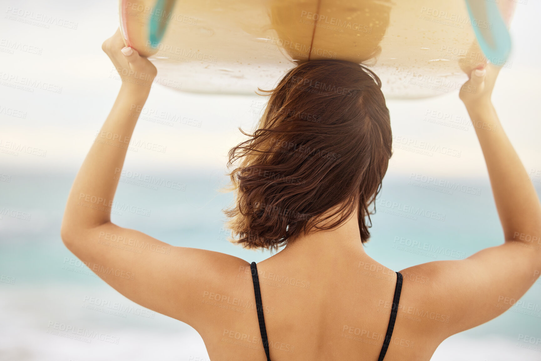 Buy stock photo Surfing, beach and woman with a surfboard on her head while on a summer vacation in Hawaii. Travel, freedom and girl on a seaside holiday, trip or adventure in nature outdoor by the ocean to surf.