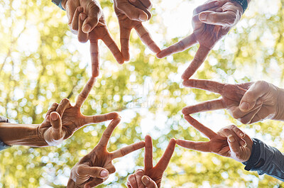Buy stock photo Hands, peace sign or team in nature with hope, support or team work for group vision, mission or goals success. Community, team building or people in partnership with motivation or teamwork in a park
